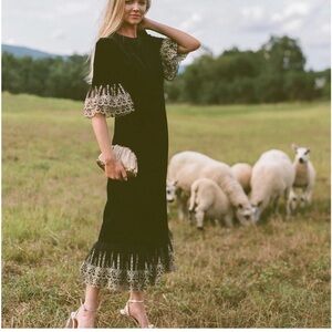 Elegant Black Dress with Gold Lace Trim
